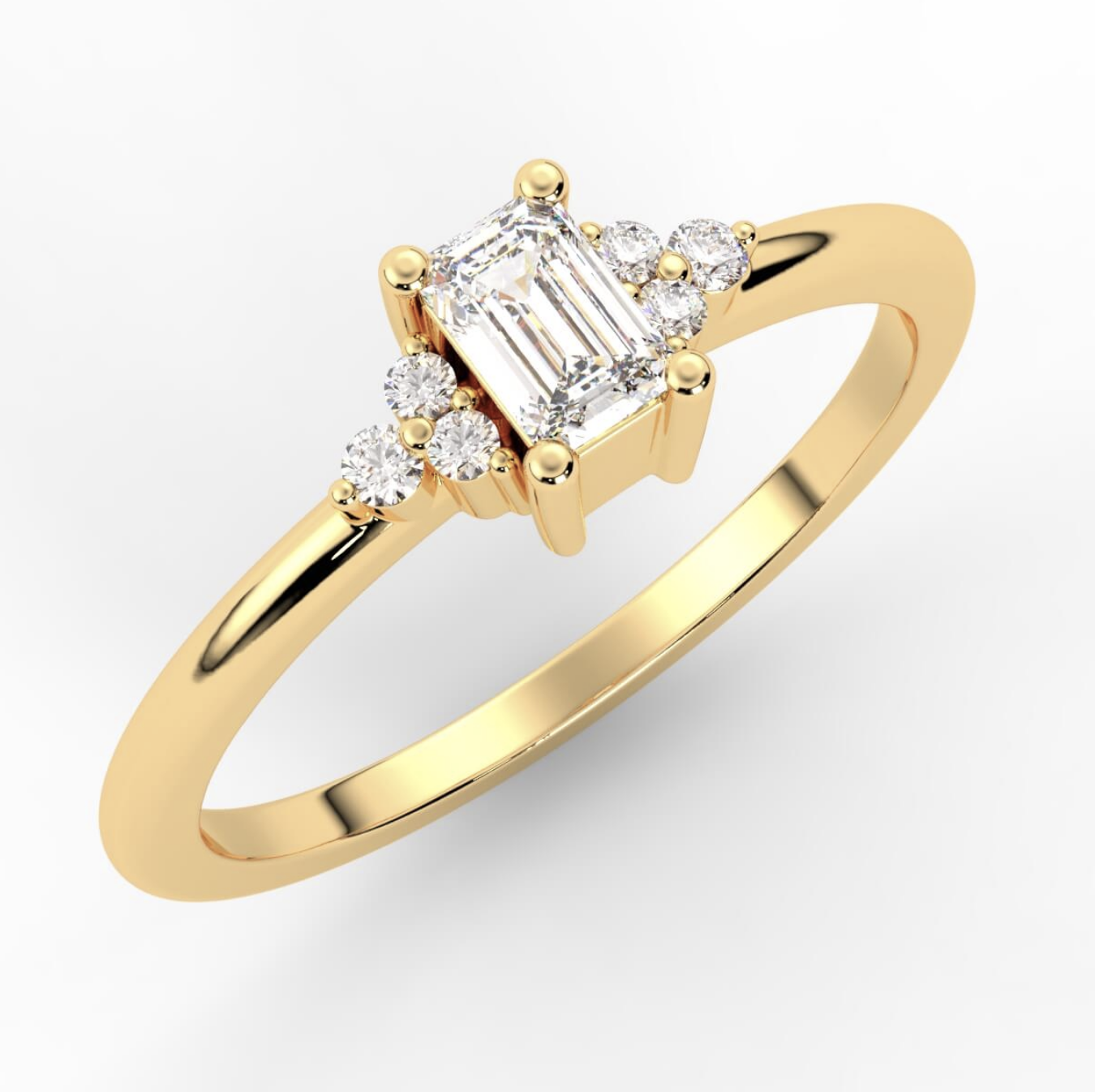 Goldringsly Acacia sidestensring med smaragdslipt diamant og briljanter.